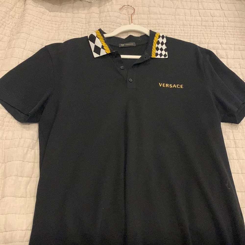 Black Versace polo with great collar detail.
